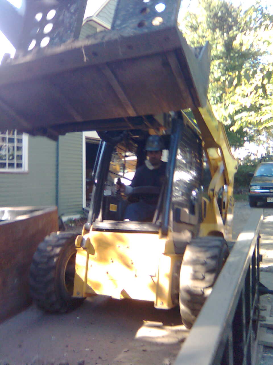 Removal of 70 Ton of dirt out of a basement via Bobcat and Conveyor